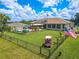 Backyard oasis with pool, solar panels and golf cart at 10177 Sunburst Ct, Spring Hill, FL 34608
