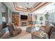 Spacious living room featuring a fireplace and built-in shelving at 10177 Sunburst Ct, Spring Hill, FL 34608