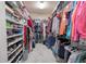 Large walk-in closet with ample shelving and hanging space at 10177 Sunburst Ct, Spring Hill, FL 34608
