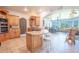 Open kitchen with granite island and breakfast bar at 10177 Sunburst Ct, Spring Hill, FL 34608