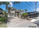 Two-story home with a large driveway and RV parking at 435 Westwinds Drive, Palm Harbor, FL 34683
