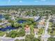 Aerial view showcasing home's waterfront location and neighborhood at 435 Westwinds Drive, Palm Harbor, FL 34683