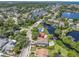 Aerial view showcasing home's location near the water at 435 Westwinds Drive, Palm Harbor, FL 34683