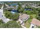 Aerial view of two-story home with RV parking near the waterfront at 435 Westwinds Drive, Palm Harbor, FL 34683