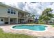 Relaxing kidney-shaped pool in backyard at 435 Westwinds Drive, Palm Harbor, FL 34683