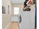Laundry room with washer, dryer, and extra storage at 435 Westwinds Drive, Palm Harbor, FL 34683