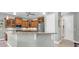 Modern kitchen with wood cabinets, granite countertops, and stainless steel appliances at 435 Westwinds Drive, Palm Harbor, FL 34683