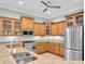 Well-equipped kitchen with ample cabinetry, granite countertops, and stainless steel appliances at 435 Westwinds Drive, Palm Harbor, FL 34683