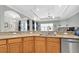 Large kitchen island with granite countertops and a double sink, perfect for entertaining at 435 Westwinds Drive, Palm Harbor, FL 34683