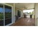 Spacious deck with built-in grill and sliding glass doors at 435 Westwinds Drive, Palm Harbor, FL 34683