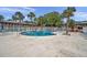 Community pool with surrounding deck and lounge chairs at 650 Pinellas Point S Dr # 106, St Petersburg, FL 33705