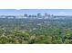 Aerial view of a neighborhood with lush green trees and a city skyline at 650 Pinellas Point S Dr # 106, St Petersburg, FL 33705