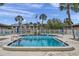 Community pool with lounge chairs and surrounding landscaping at 650 Pinellas Point S Dr # 106, St Petersburg, FL 33705