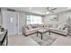 Living room with sectional sofa and a coffee table at 650 Pinellas Point S Dr # 106, St Petersburg, FL 33705