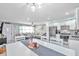 Bright dining area with white table and chairs at 650 Pinellas Point S Dr # 106, St Petersburg, FL 33705