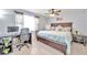 Bright bedroom with king-size bed and workspace at 650 Pinellas Point S Dr # 106, St Petersburg, FL 33705