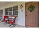 Charming front entry with a wreath and welcoming decor at 650 Pinellas Point S Dr # 106, St Petersburg, FL 33705
