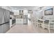 Modern kitchen with stainless steel appliances and white cabinets at 650 Pinellas Point S Dr # 106, St Petersburg, FL 33705