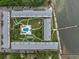 Aerial view of waterfront community with pool and parking at 650 Pinellas Point S Dr # 106, St Petersburg, FL 33705