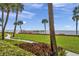 Scenic waterfront view with a private pier and lush landscaping at 650 Pinellas Point S Dr # 106, St Petersburg, FL 33705