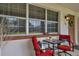 Inviting front porch with seating for relaxing outdoors at 650 Pinellas Point S Dr # 106, St Petersburg, FL 33705