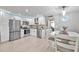 Modern kitchen with stainless steel appliances and white cabinets at 650 Pinellas Point S Dr # 106, St Petersburg, FL 33705