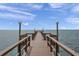 Long wooden pier extending over the water, perfect for fishing at 650 Pinellas Point S Dr # 106, St Petersburg, FL 33705