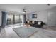 Living room with comfortable seating and large windows at 200 Country Club Dr # 1004, Largo, FL 33771