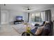 Open living area with lots of natural light and comfortable seating at 200 Country Club Dr # 1004, Largo, FL 33771