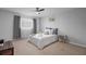 Cozy bedroom with plush bedding and ceiling fan at 200 Country Club Dr # 1004, Largo, FL 33771