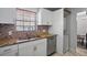 Updated kitchen featuring granite countertops and ample cabinet space at 200 Country Club Dr # 1004, Largo, FL 33771