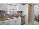 Updated kitchen featuring granite countertops and ample cabinet space at 200 Country Club Dr # 1004, Largo, FL 33771