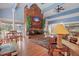 Bright community room featuring a brick fireplace and comfortable seating at 200 Country Club Dr # 1004, Largo, FL 33771