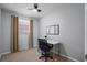 Bright bedroom with window, desk and chair, and neutral decor at 200 Country Club Dr # 1004, Largo, FL 33771