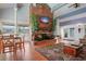 Community room with a brick fireplace, seating area, and dining table at 200 Country Club Dr # 1004, Largo, FL 33771