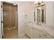Bathroom with walk-in shower and updated vanity at 903 San Carlos Ne Ave, St Petersburg, FL 33702