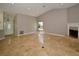 Spacious living room with tile floors, fireplace, and high ceilings at 903 San Carlos Ne Ave, St Petersburg, FL 33702