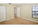 Second bedroom with neutral walls and carpet at 903 San Carlos Ne Ave, St Petersburg, FL 33702