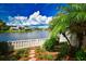 Lakefront backyard with lush landscaping at 903 San Carlos Ne Ave, St Petersburg, FL 33702