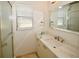 Bathroom features vanity with marble countertop at 903 San Carlos Ne Ave, St Petersburg, FL 33702