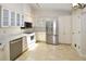 Updated kitchen with stainless steel appliances and tile floor at 903 San Carlos Ne Ave, St Petersburg, FL 33702