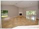 Spacious living room with a fireplace and view to the backyard at 903 San Carlos Ne Ave, St Petersburg, FL 33702