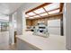 Kitchen features wood cabinets, a skylight, and pass-through to living area at 320 Windrush Blvd # 4, Indian Rocks Beach, FL 33785