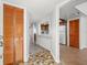 Bright entryway with wood flooring and access to kitchen at 320 Windrush Blvd # 4, Indian Rocks Beach, FL 33785