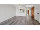 Bright dining room with laminate flooring and kitchen pass-through at 320 Windrush Blvd # 4, Indian Rocks Beach, FL 33785