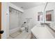 Clean bathroom with a shower/tub combo and wood vanity at 320 Windrush Blvd # 4, Indian Rocks Beach, FL 33785