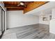 Spacious living room featuring wood beamed ceilings and laminate flooring at 320 Windrush Blvd # 4, Indian Rocks Beach, FL 33785