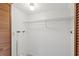 Small laundry room with shelving and hookups at 320 Windrush Blvd # 4, Indian Rocks Beach, FL 33785