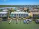Aerial view of waterfront property with boat docks at 320 Windrush Blvd # 4, Indian Rocks Beach, FL 33785