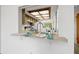 Kitchen features a pass-through to the dining area at 320 Windrush Blvd # 4, Indian Rocks Beach, FL 33785